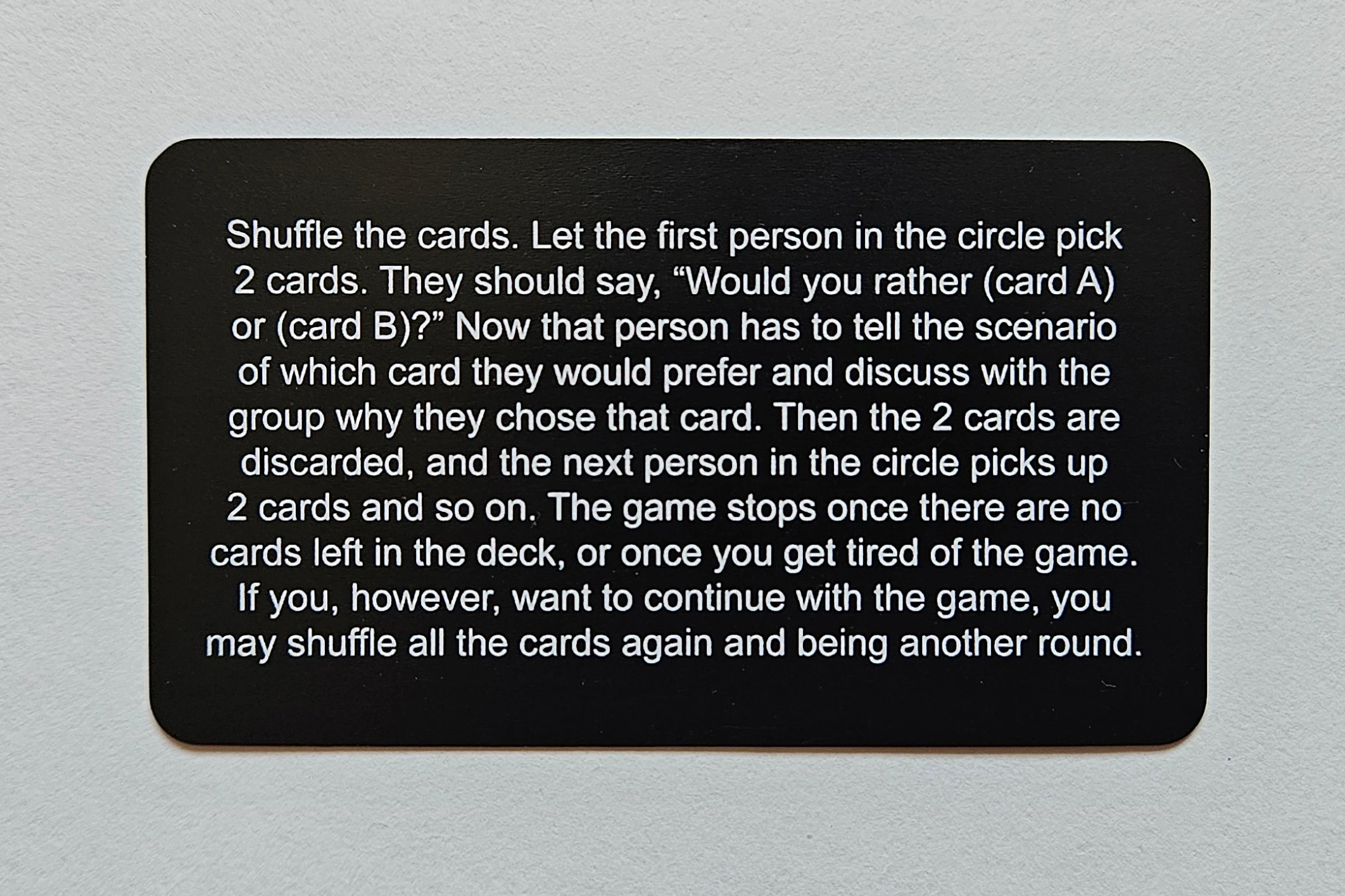 Rules card of Deliberation would-you-rather social card game